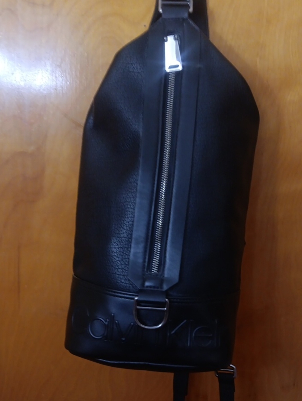Calvin Klein Black Leather Belt Sling Bag with Silver Zip